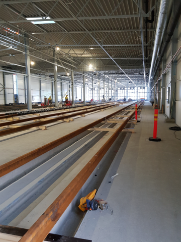 The installation of tracks is progressing inside the storage hall